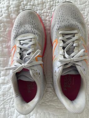 New Balance Women's Light Gray Running Shoes with Pink and Orange Accents